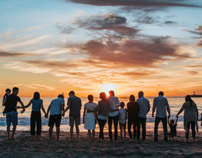 group standing in front of beach